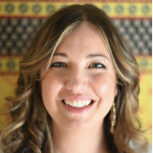 Photo of woman with long blonde hair smiling directly into camera